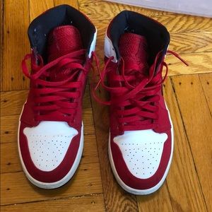 Red, White & black  mid Jordan 1’s. Good condition